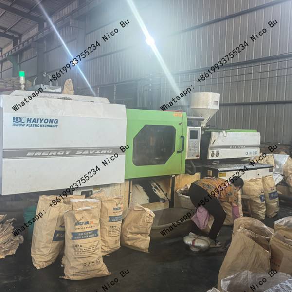 Technicians assembling custom OEM steel and plastic drag chain systems
