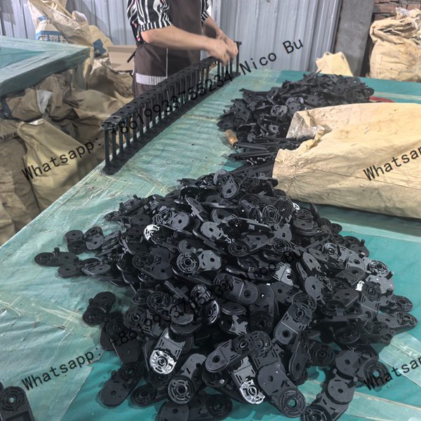 factory-worker-assembling-25x38mm-plastic-cable-drag-chain-components